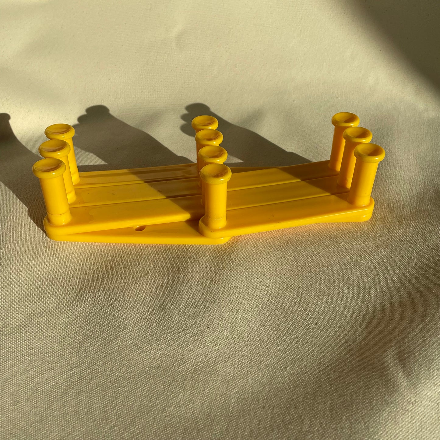 Vintage Yellow Plastic Expandable Peg Rack