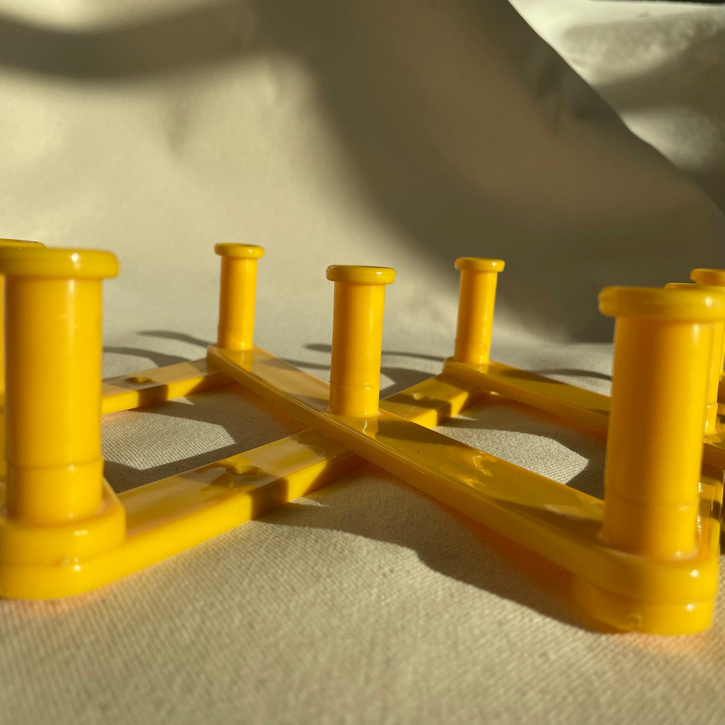 Vintage Yellow Plastic Expandable Peg Rack