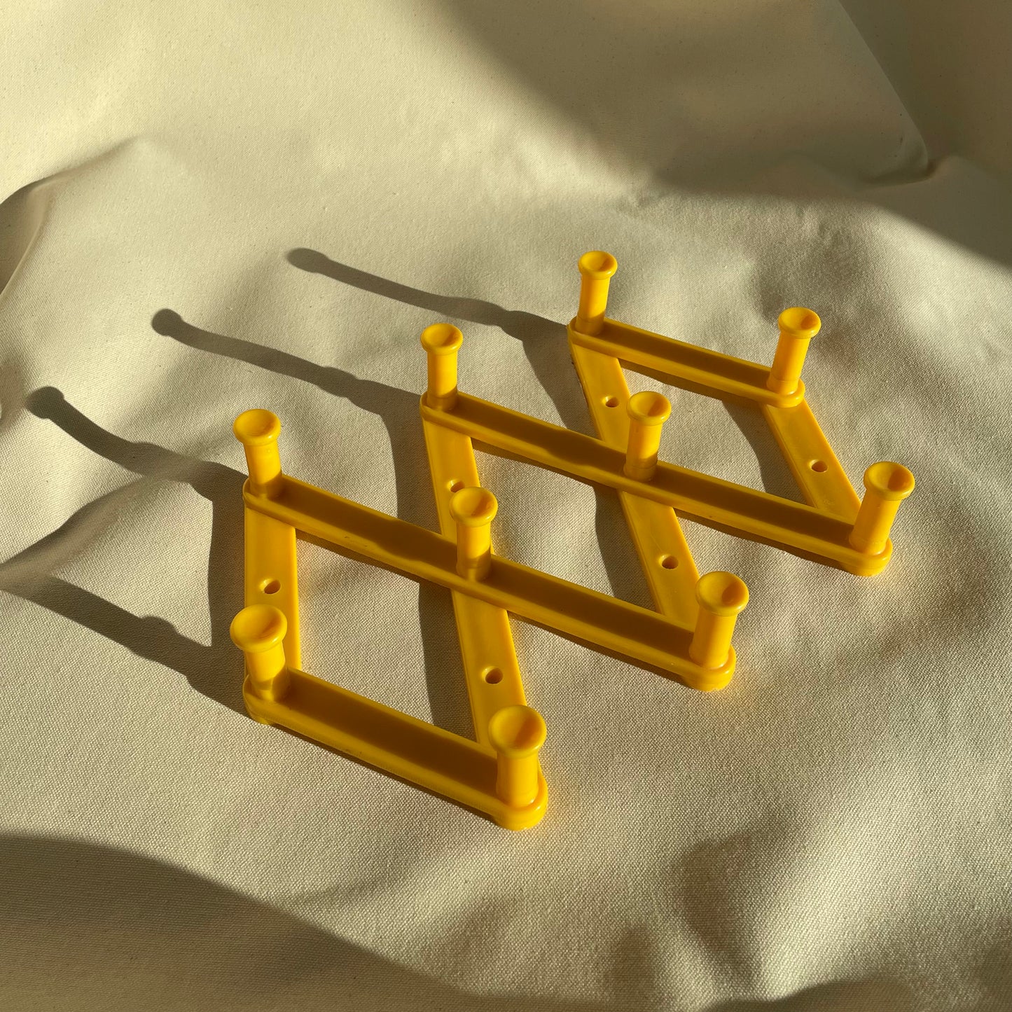 Vintage Yellow Plastic Expandable Peg Rack
