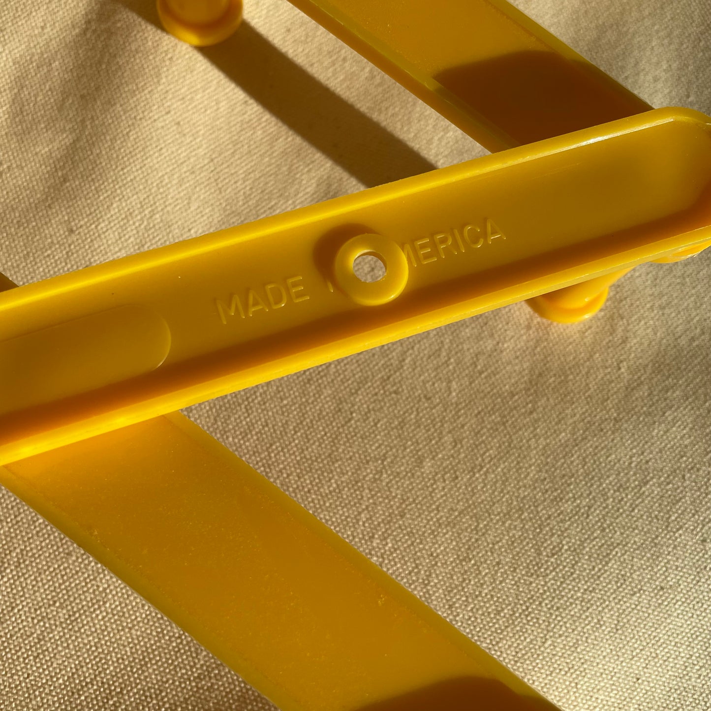 Vintage Yellow Plastic Expandable Peg Rack